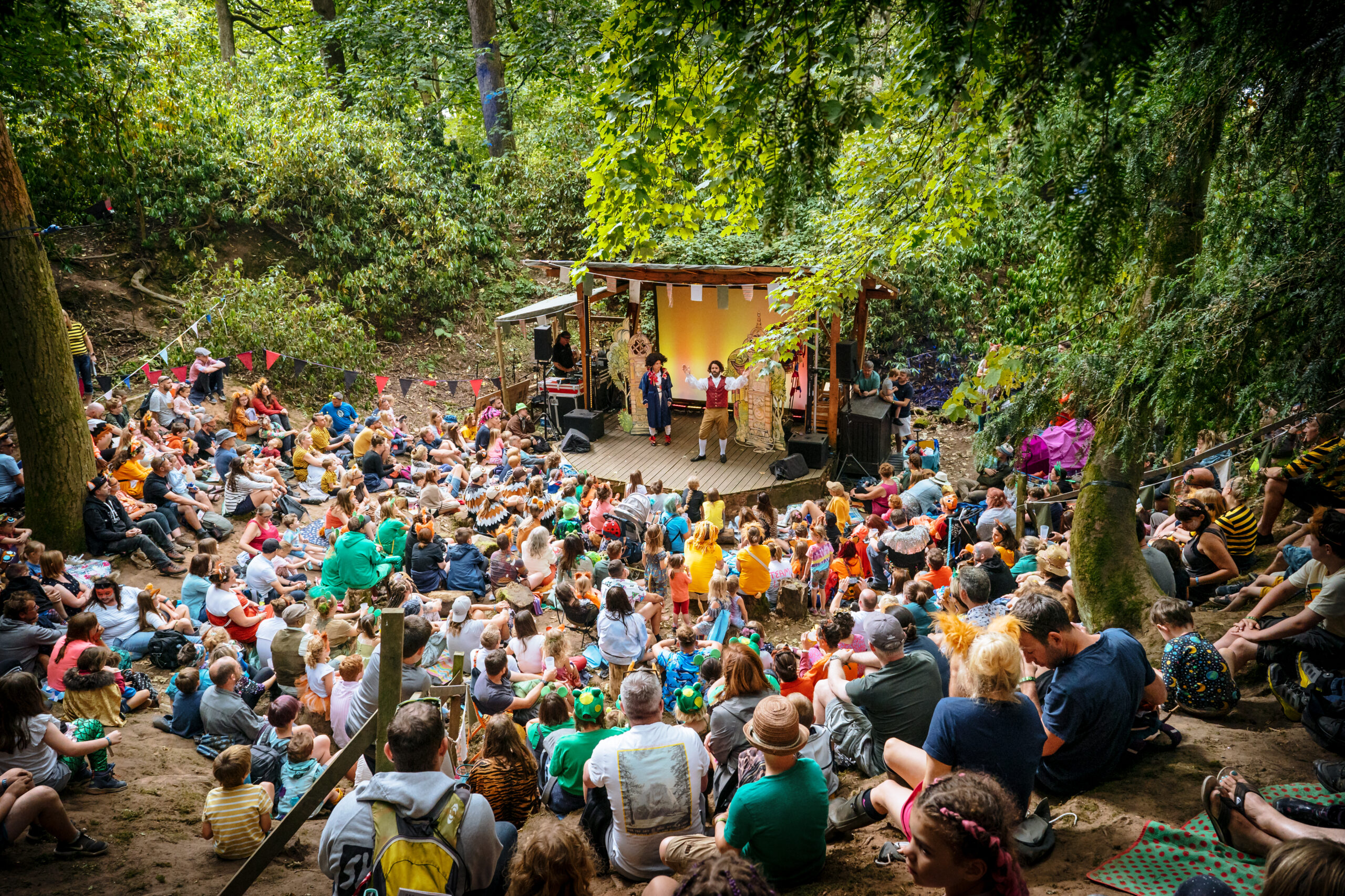 A theatre performance outside in a woodland glade