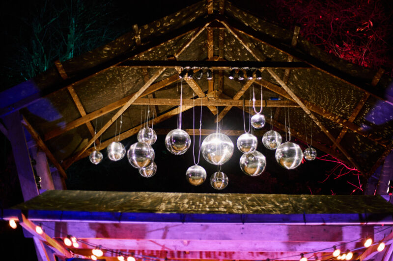 Glittering mirror balls hanging above a stage